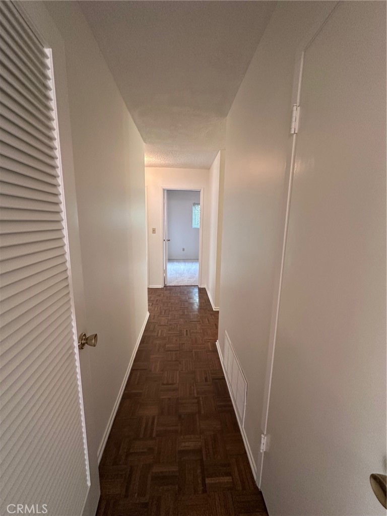 20631 Romar Street Chatsworth, CA 91311 - Photo 16 of 34 a walk in closet with wooden floor