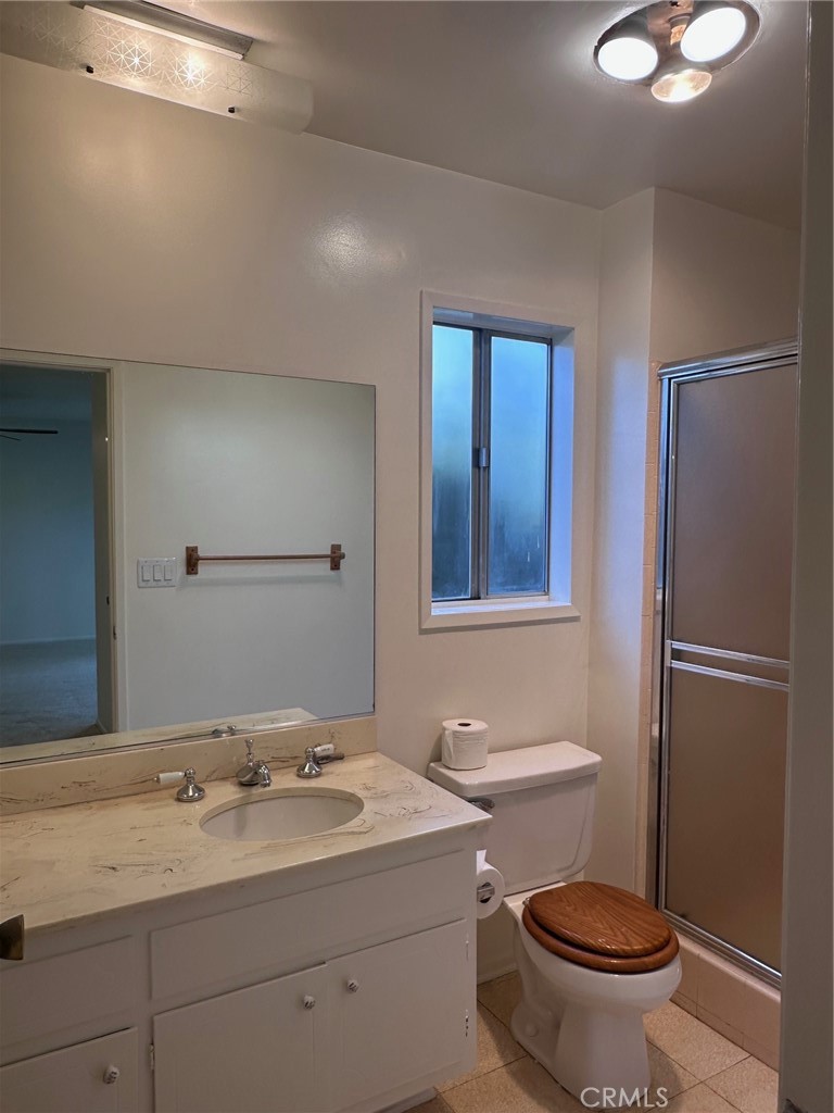 20631 Romar Street Chatsworth, CA 91311 - Photo 19 of 34 a bathroom with a sink toilet and shower