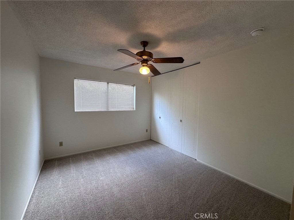 20631 Romar Street Chatsworth, CA 91311 - Photo 23 of 34 an empty room with a window and a fan