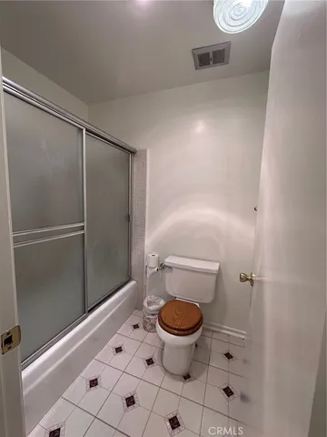 a bathroom with a toilet and a sink