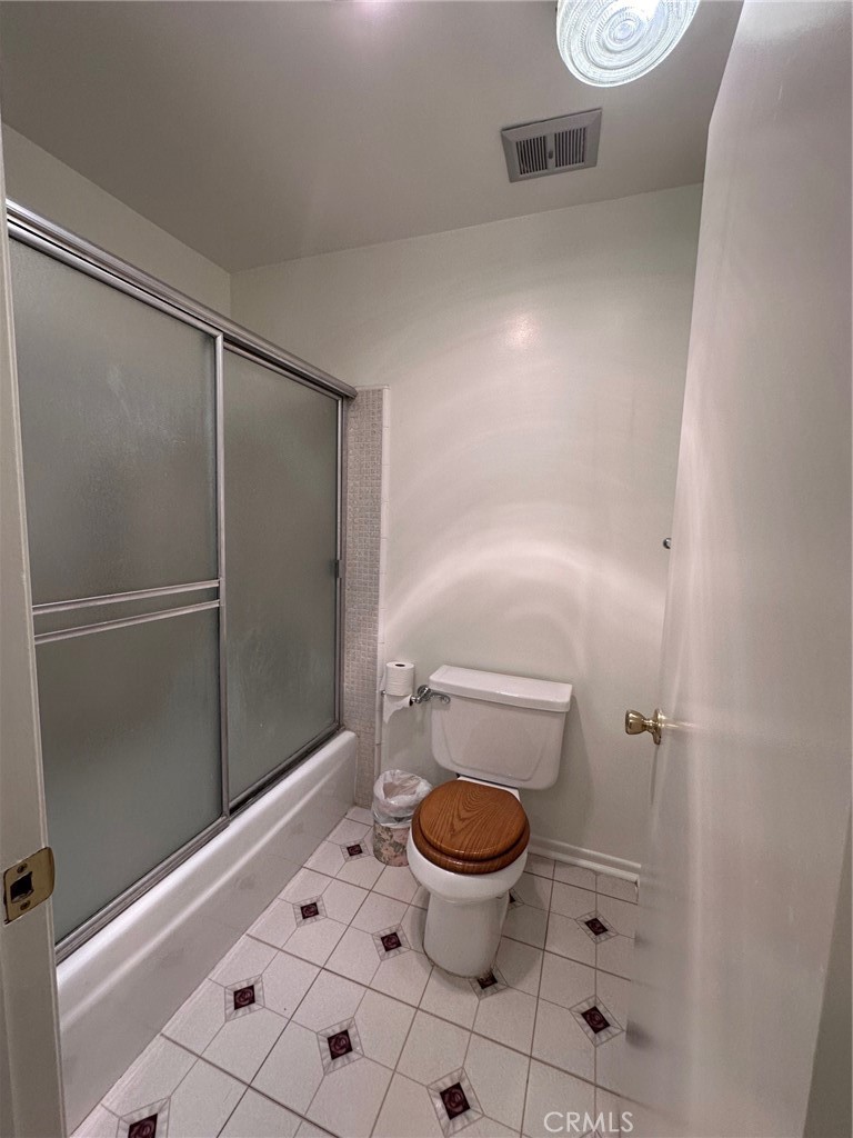 20631 Romar Street Chatsworth, CA 91311 - Photo 26 of 34 a bathroom with a toilet and a sink