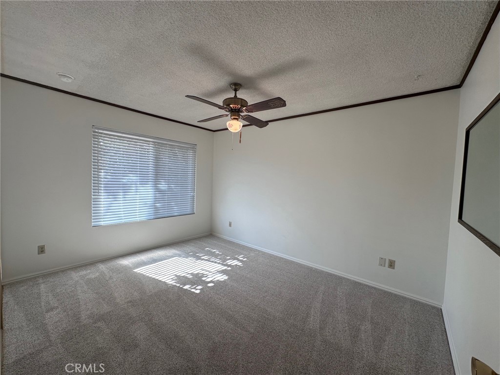 20631 Romar Street Chatsworth, CA 91311 - Photo 29 of 34 a view of a livingroom with a ceiling fan and window