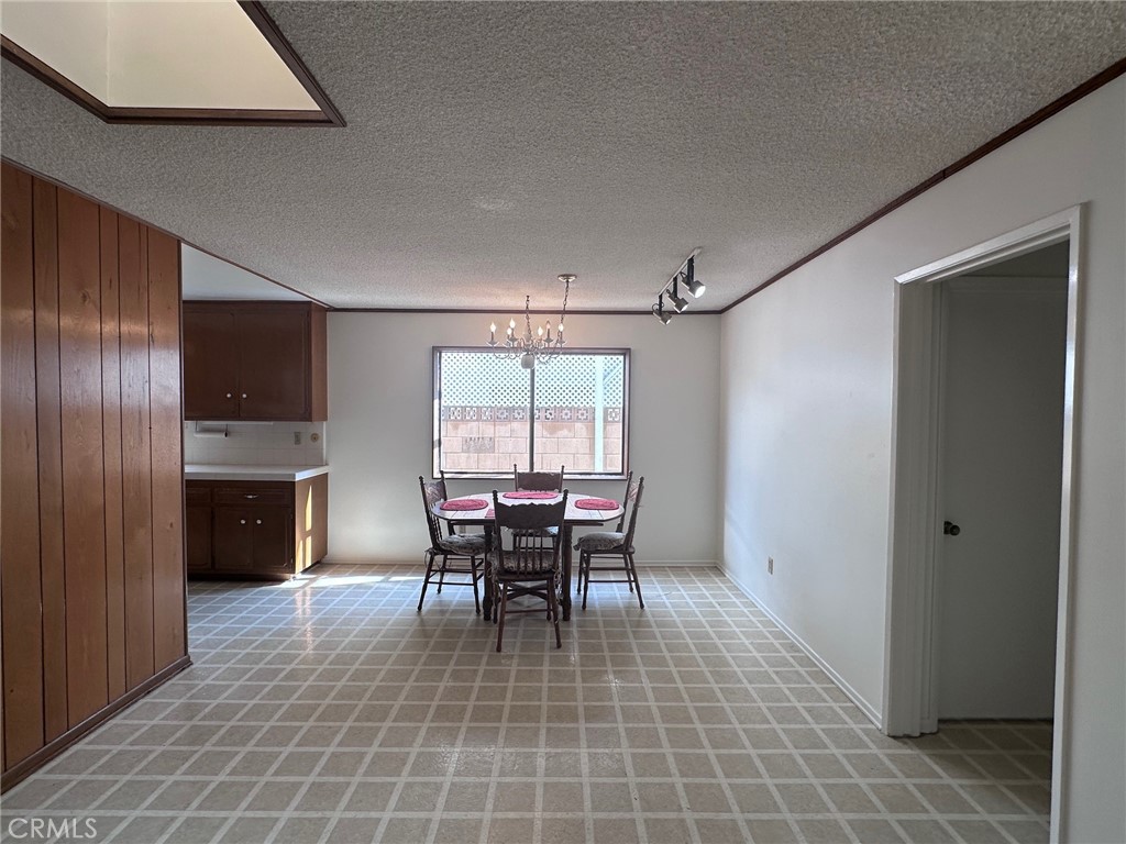 20631 Romar Street Chatsworth, CA 91311 - Photo 3 of 34 a dining room with furniture and window