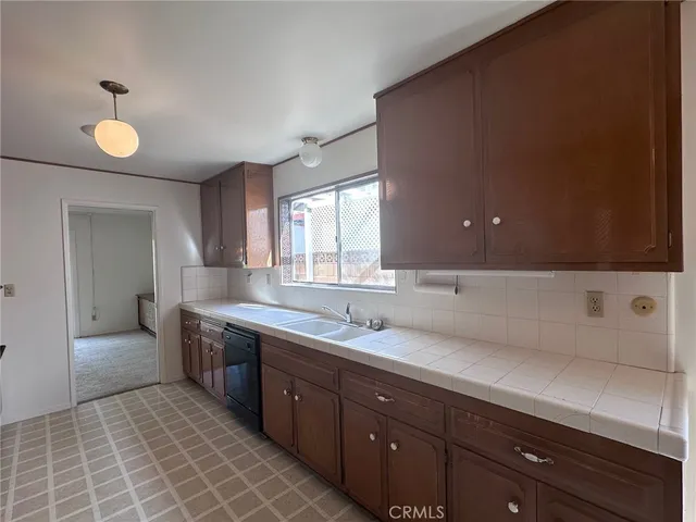 a spacious bathroom with a sink and a mirror