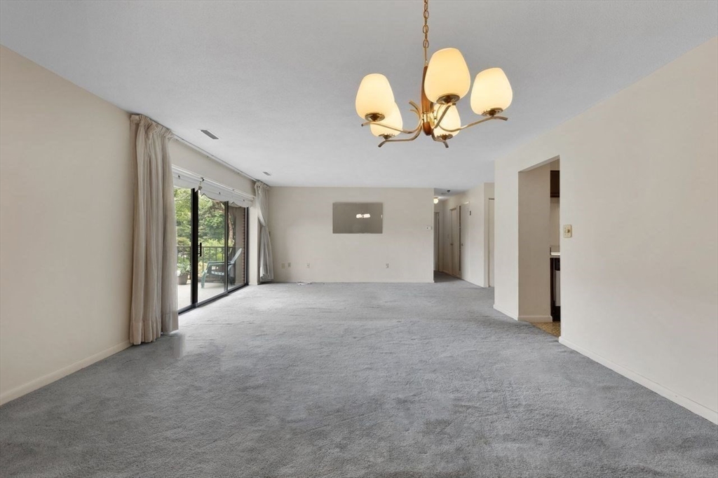 1008 Paradise Road, Unit 2Q Swampscott, MA 01907 - Photo 12 of 25 a view of a kitchen a chandelier fan and windows