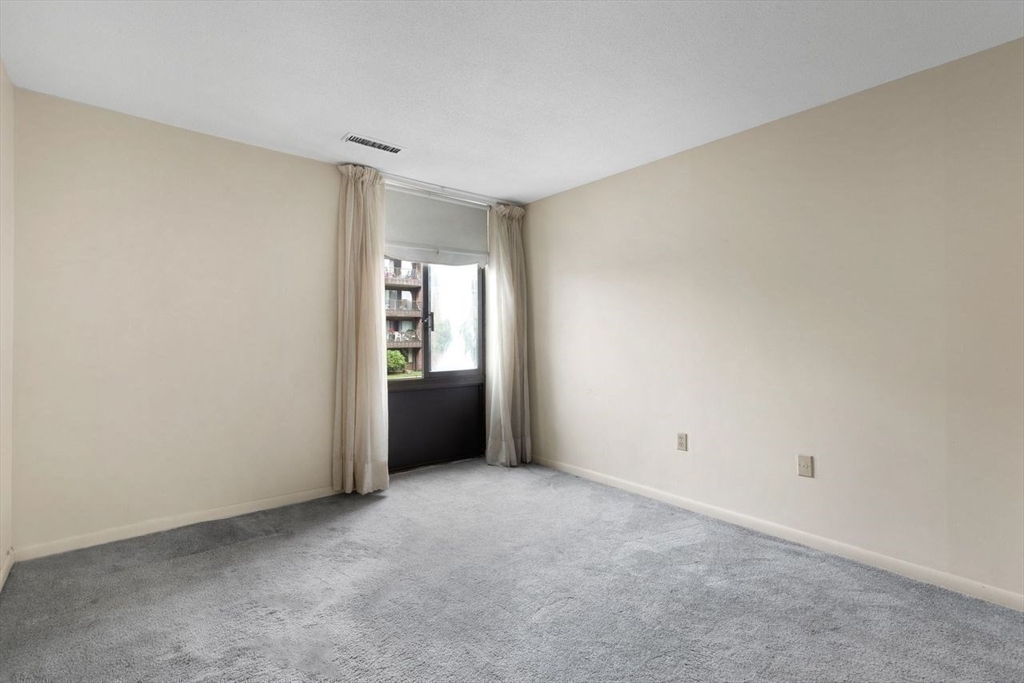 1008 Paradise Road, Unit 2Q Swampscott, MA 01907 - Photo 16 of 25 a view of an empty room and fire place