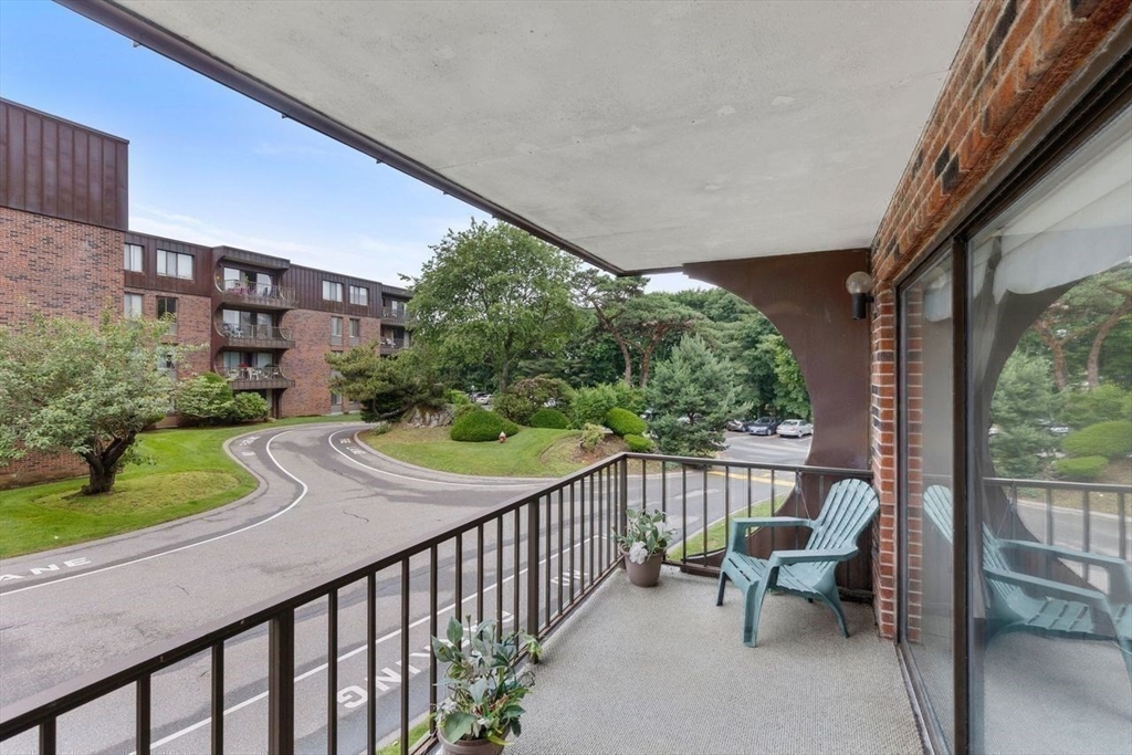 1008 Paradise Road, Unit 2Q Swampscott, MA 01907 - Photo 21 of 25 a view of a patio with couches table and chairs and potted plants