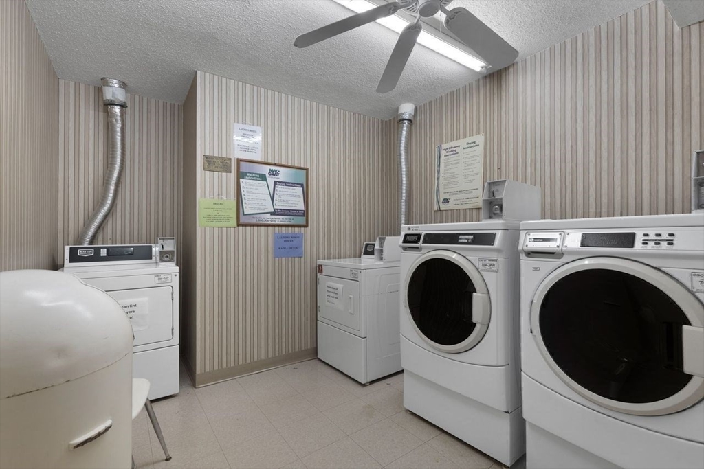 1008 Paradise Road, Unit 2Q Swampscott, MA 01907 - Photo 22 of 25 a view of a storage & utility room with a washer dryer
