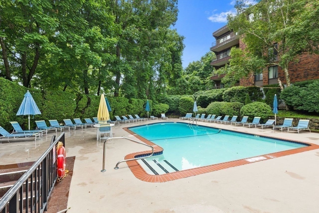 1008 Paradise Road, Unit 2Q Swampscott, MA 01907 - Photo 23 of 25 swimming pool with outdoor seating and yard
