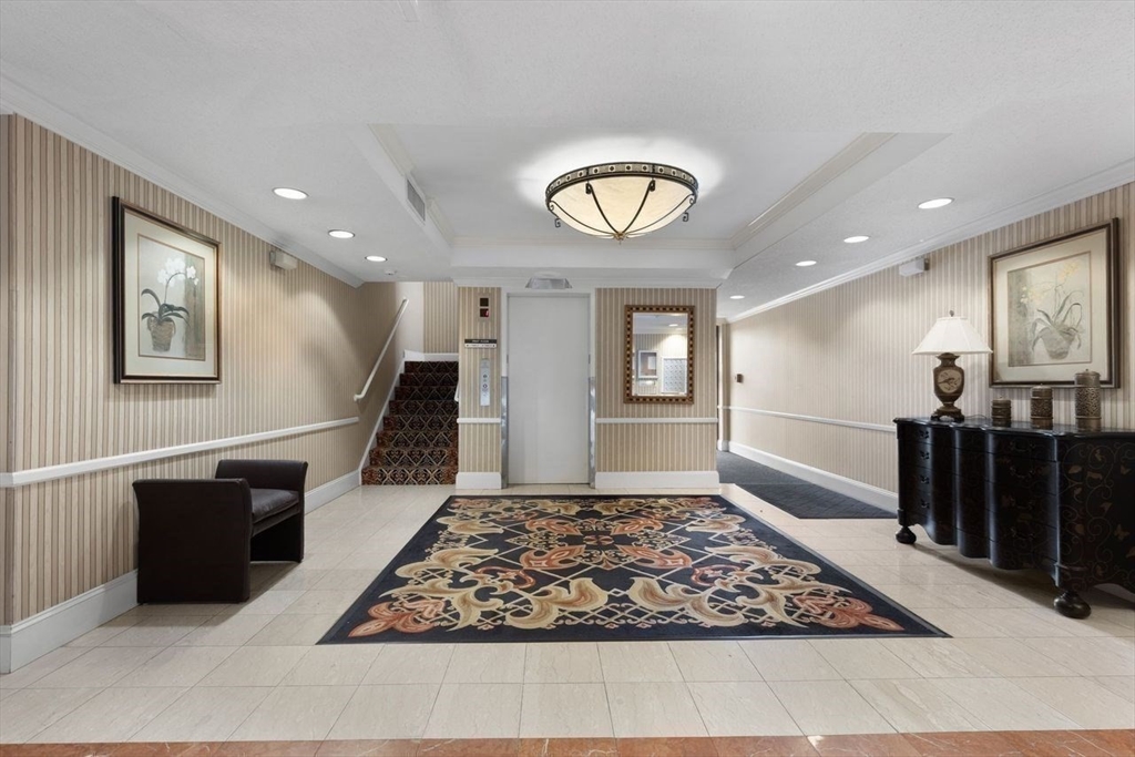 1008 Paradise Road, Unit 2Q Swampscott, MA 01907 - Photo 6 of 25 a view of a livingroom with furniture and window