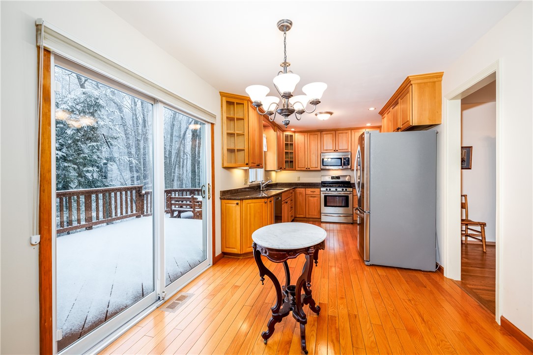 18 Bent Oak Road Chili, NY 14624 - Photo 17 of 47 Kitchen and sliding doors leading to back deck