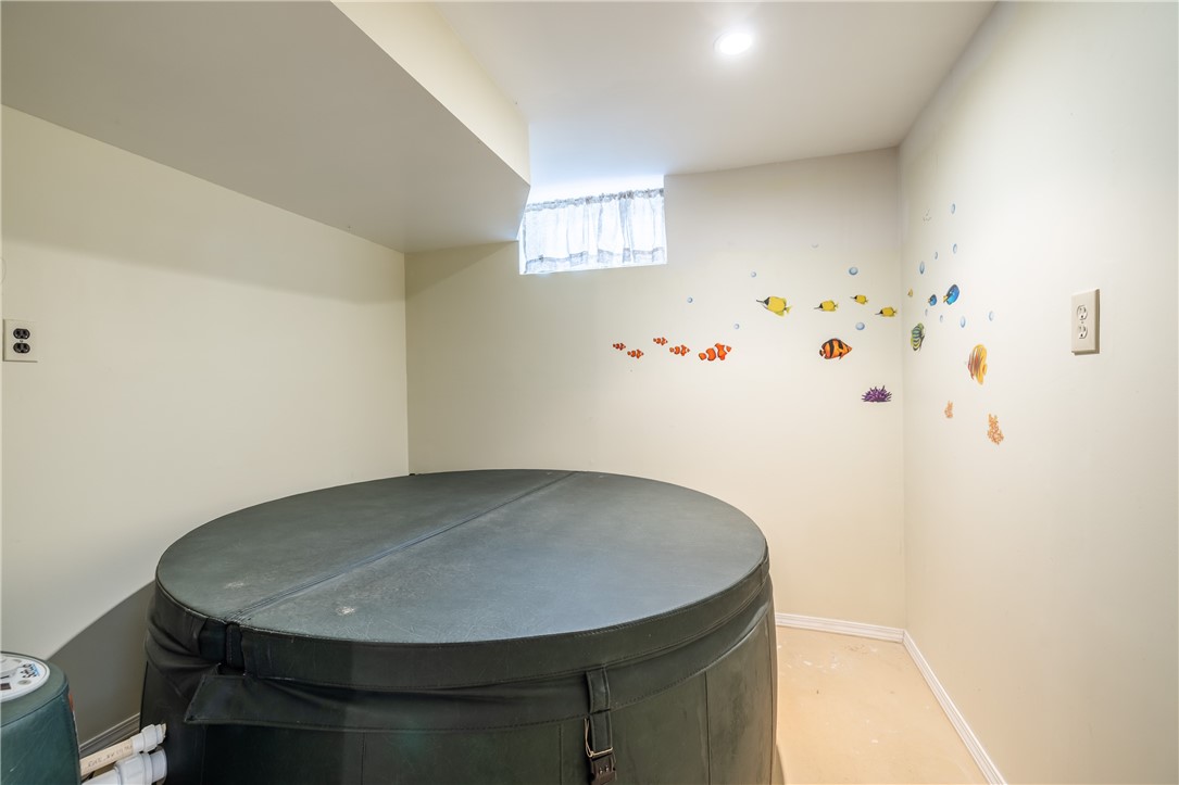 18 Bent Oak Road Chili, NY 14624 - Photo 36 of 47 Basement room with Hot tub and walk out to covered