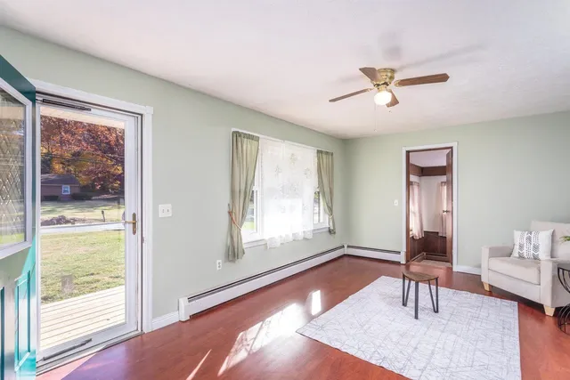 a living room with furniture and a window