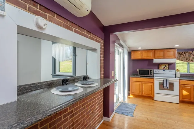 a kitchen with a stove a sink and a refrigerator