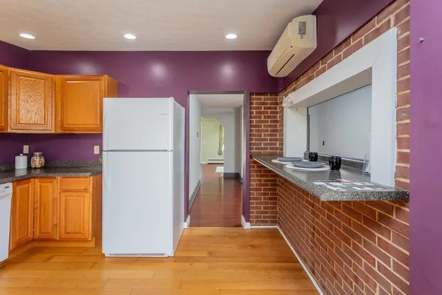 a view of front door with wooden floor