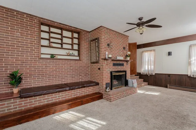 a view of livingroom with furniture and fireplace