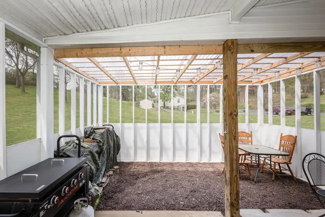 a bed sitting in a room next to a window