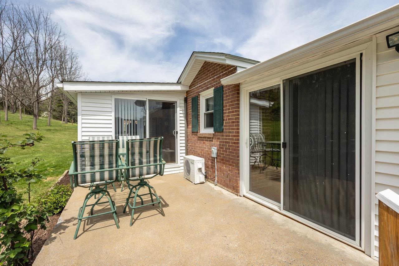911 Old White Hill Road Stuarts Draft, VA 24477 - Photo 9 of 40 a view of a chair and table in backyard of house