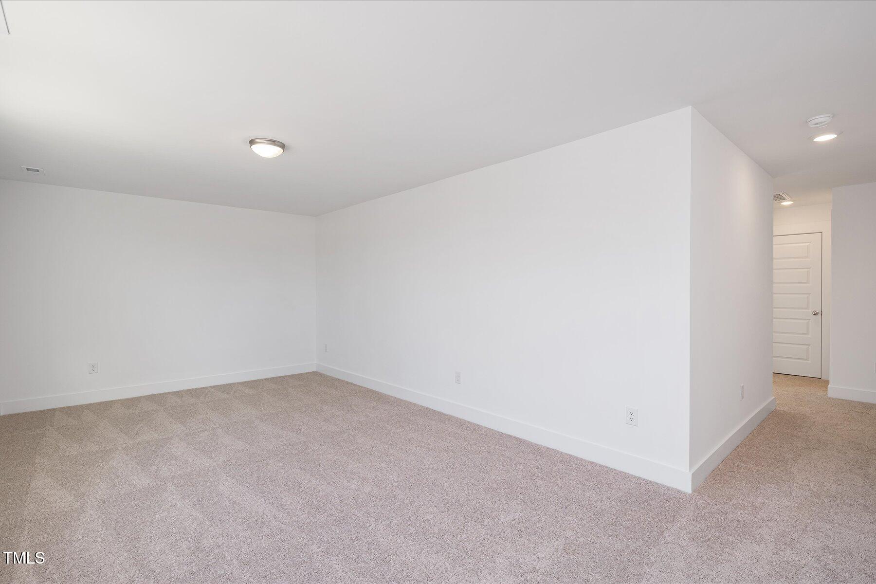 3939 Willow Gate Way Raleigh, NC 27604 - Photo 14 of 32 an empty room with an entryway