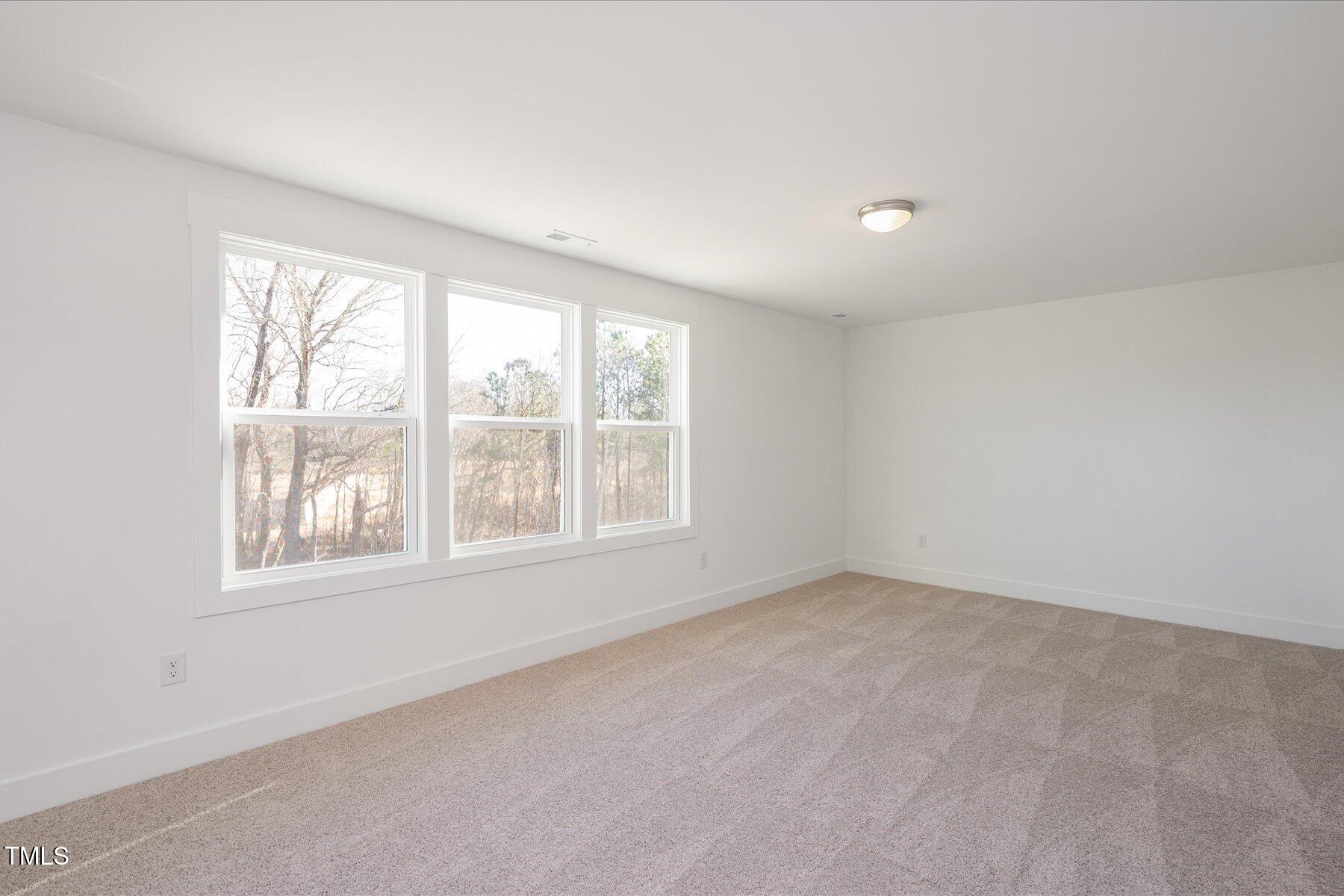 3939 Willow Gate Way Raleigh, NC 27604 - Photo 15 of 32 an empty room with a window