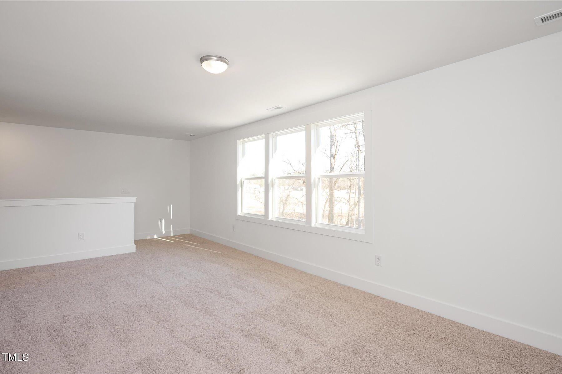 3939 Willow Gate Way Raleigh, NC 27604 - Photo 16 of 32 an empty room with windows