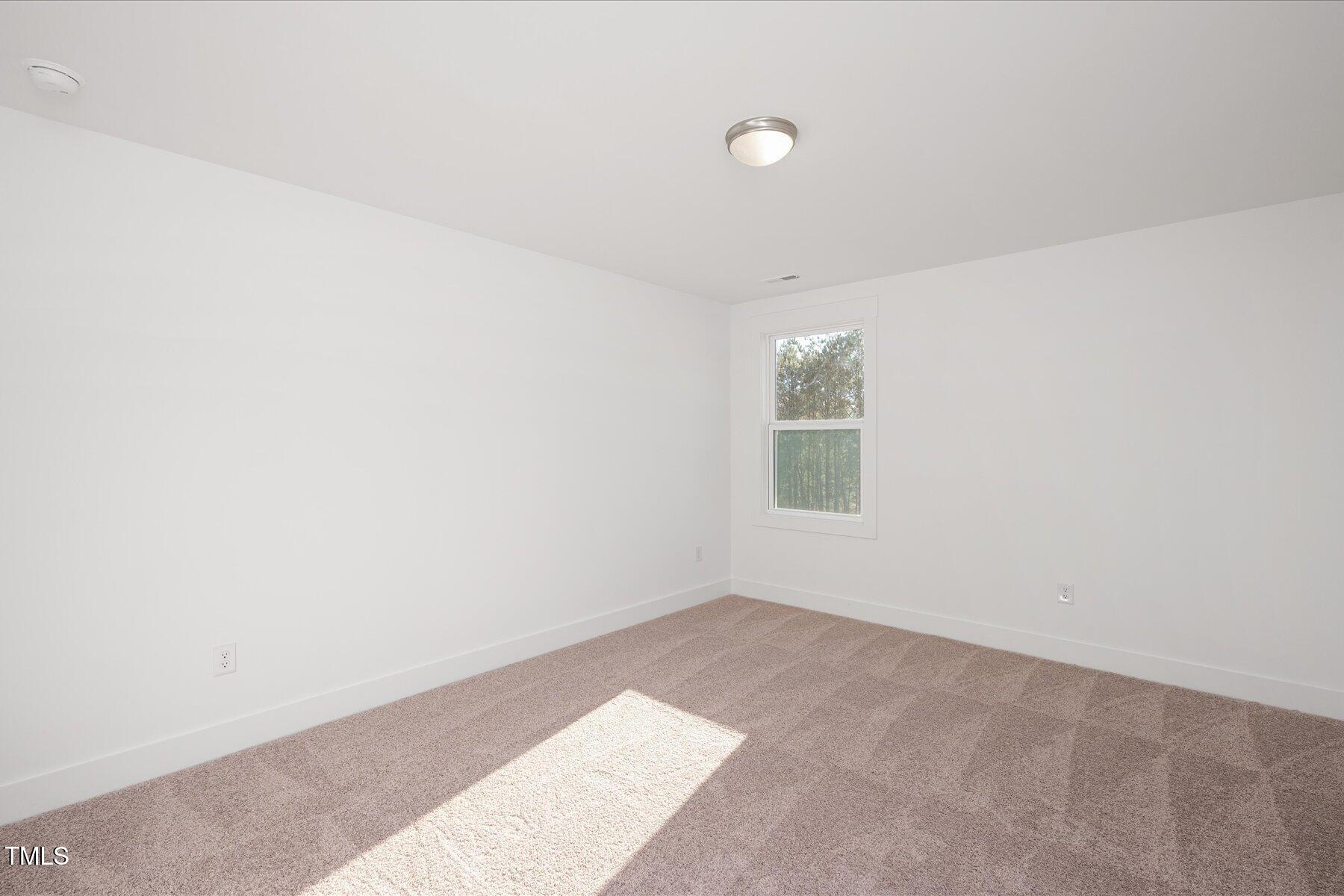 3939 Willow Gate Way Raleigh, NC 27604 - Photo 17 of 32 an empty room with windows