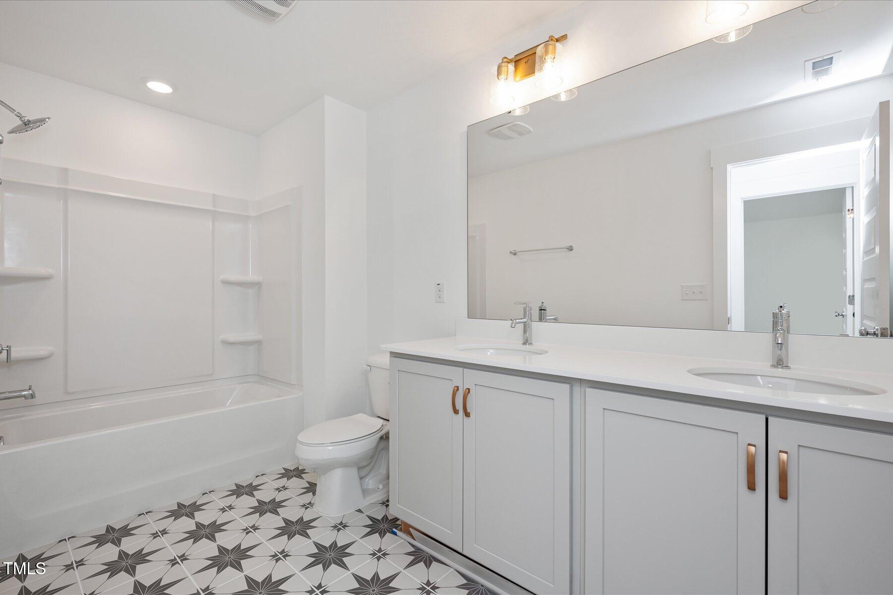3939 Willow Gate Way Raleigh, NC 27604 - Photo 19 of 32 a bathroom with a sink a toilet and shower