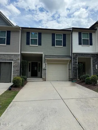 a front view of a house with yard