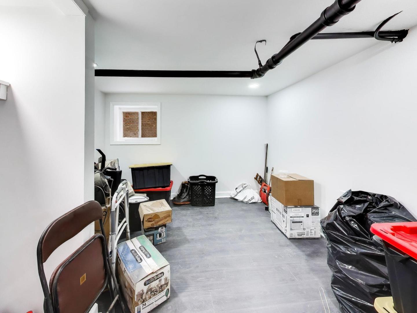 8322 South Sangamon Street Chicago, IL 60620 - Photo 11 of 36 a bedroom with furniture and a fireplace