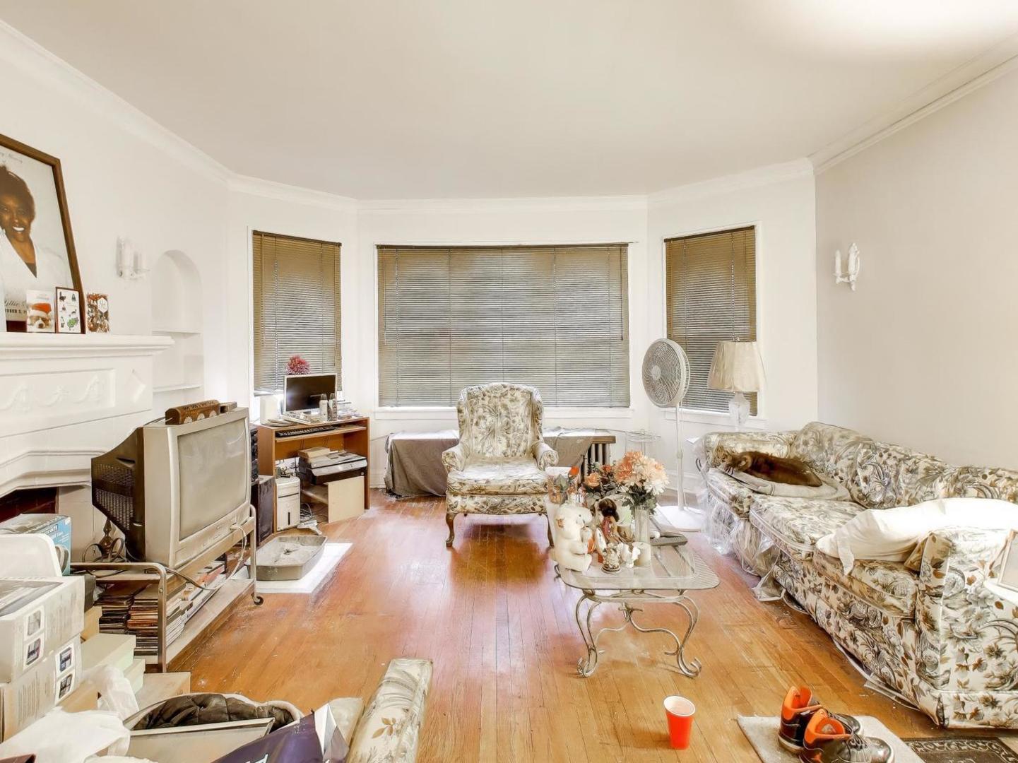 8322 South Sangamon Street Chicago, IL 60620 - Photo 22 of 36 a living room with furniture and a wooden floor