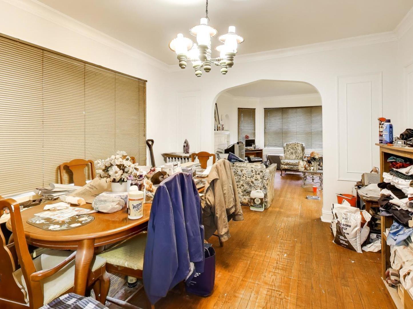 8322 South Sangamon Street Chicago, IL 60620 - Photo 24 of 36 a view of a dining room with furniture and a chandelier