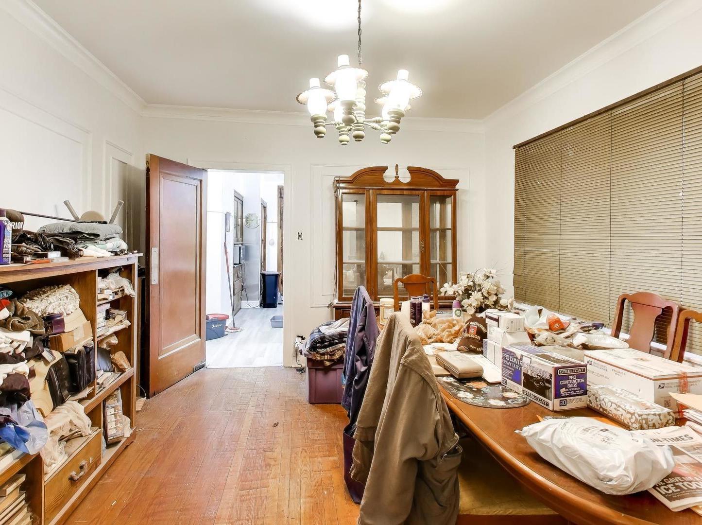8322 South Sangamon Street Chicago, IL 60620 - Photo 25 of 36 a view of a dining room with furniture and a chandelier