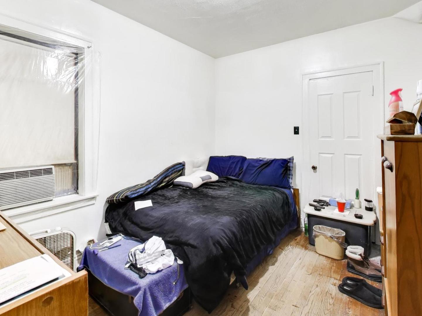 8322 South Sangamon Street Chicago, IL 60620 - Photo 30 of 36 a bed room with a bed and a window