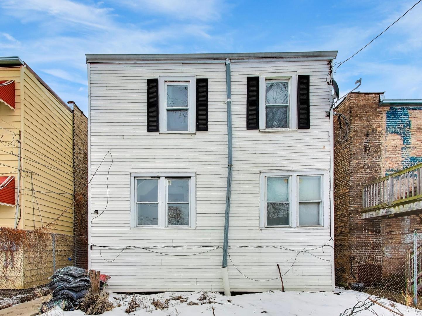 8322 South Sangamon Street Chicago, IL 60620 - Photo 33 of 36 a front view of a house with many windows