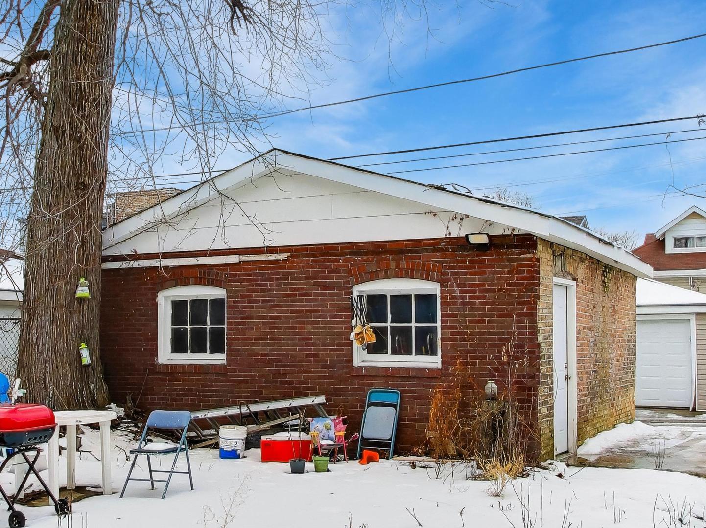 8322 South Sangamon Street Chicago, IL 60620 - Photo 36 of 36 a outdoor view of a house with a patio