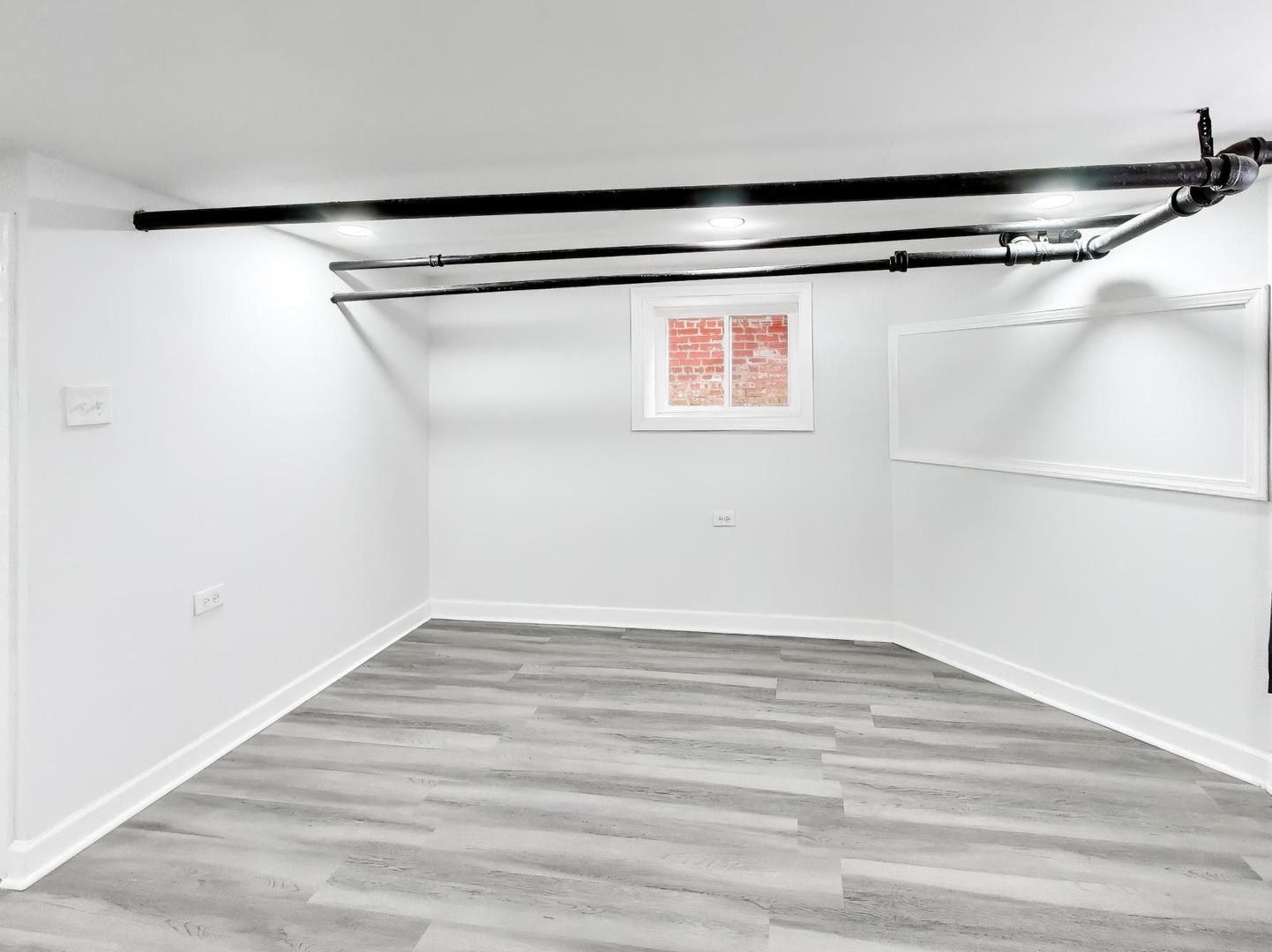 8322 South Sangamon Street Chicago, IL 60620 - Photo 6 of 36 a view of a room with racks on the wall