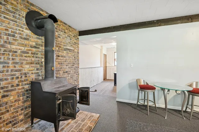a reading room with furniture and wooden floor
