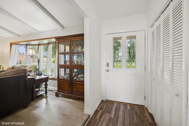 a view of a livingroom with furniture and hardwood floor