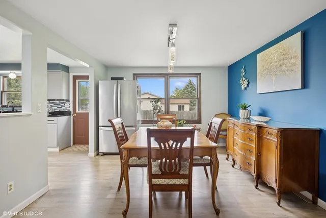 a view of a dining room with furniture window and outside view