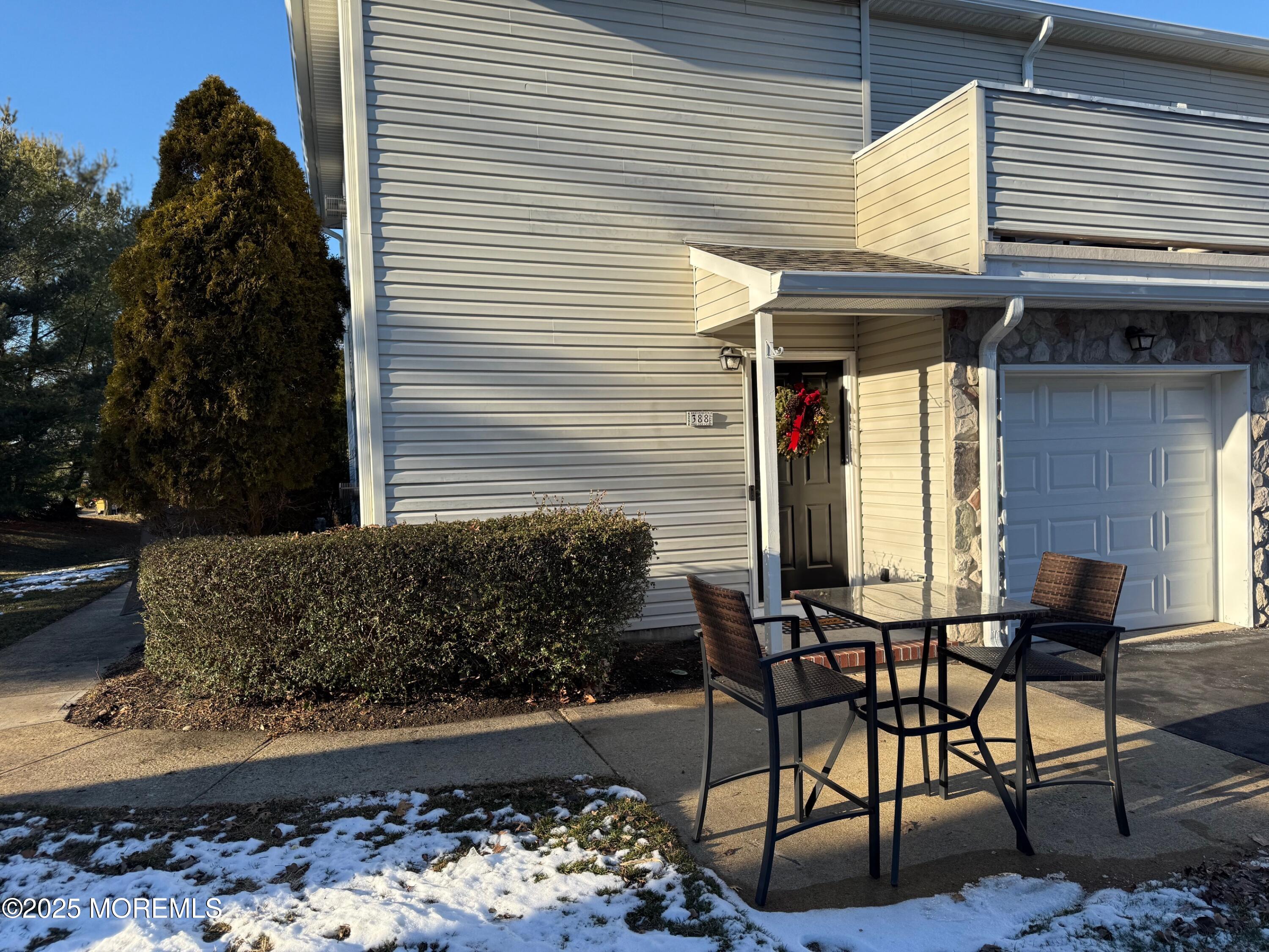 388 Deuce Drive Wall, NJ 07719 - Photo 2 of 38 a view of a patio with table and chairs and potted plants