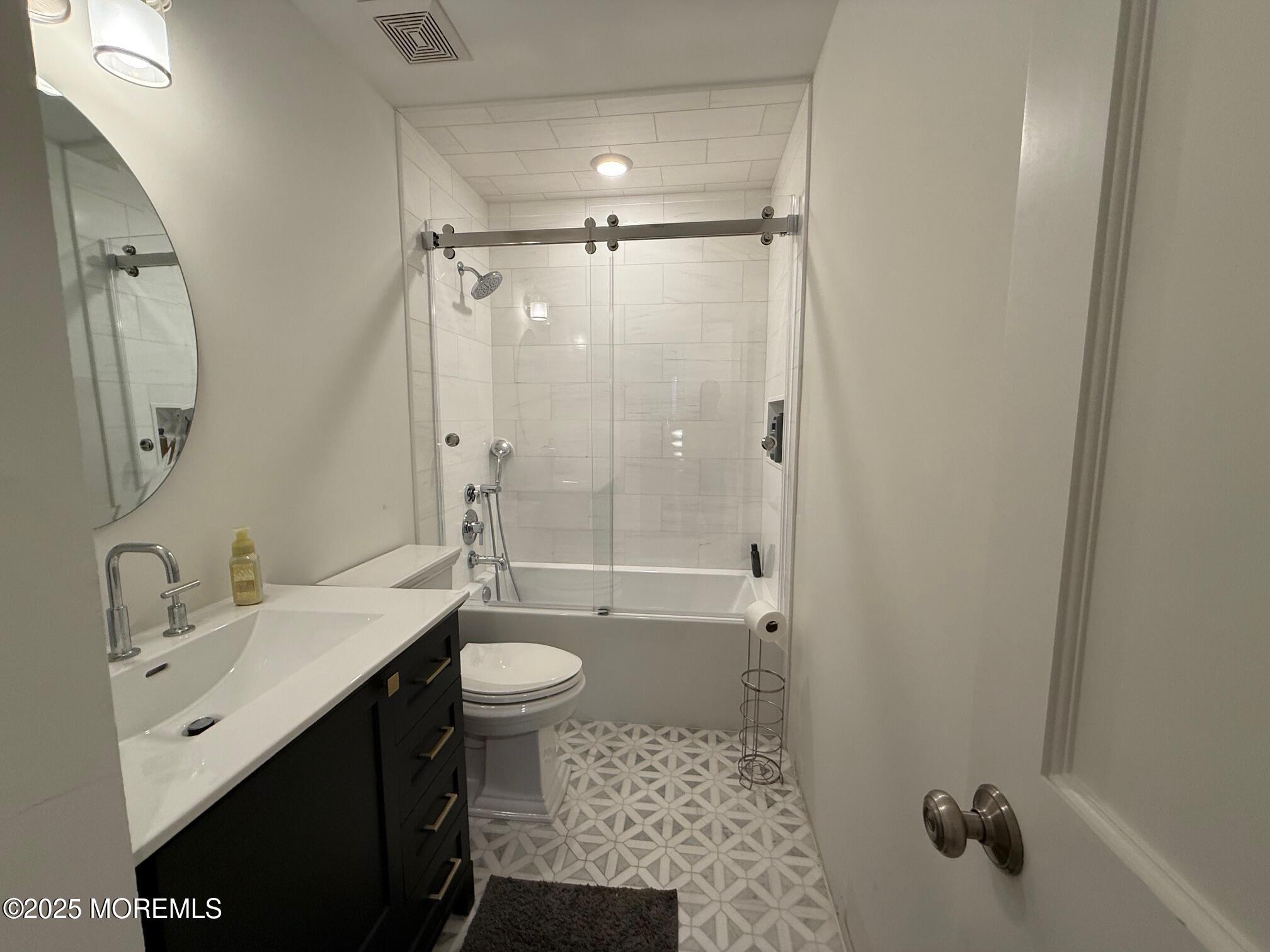 388 Deuce Drive Wall, NJ 07719 - Photo 21 of 38 a bathroom with a sink a toilet and shower