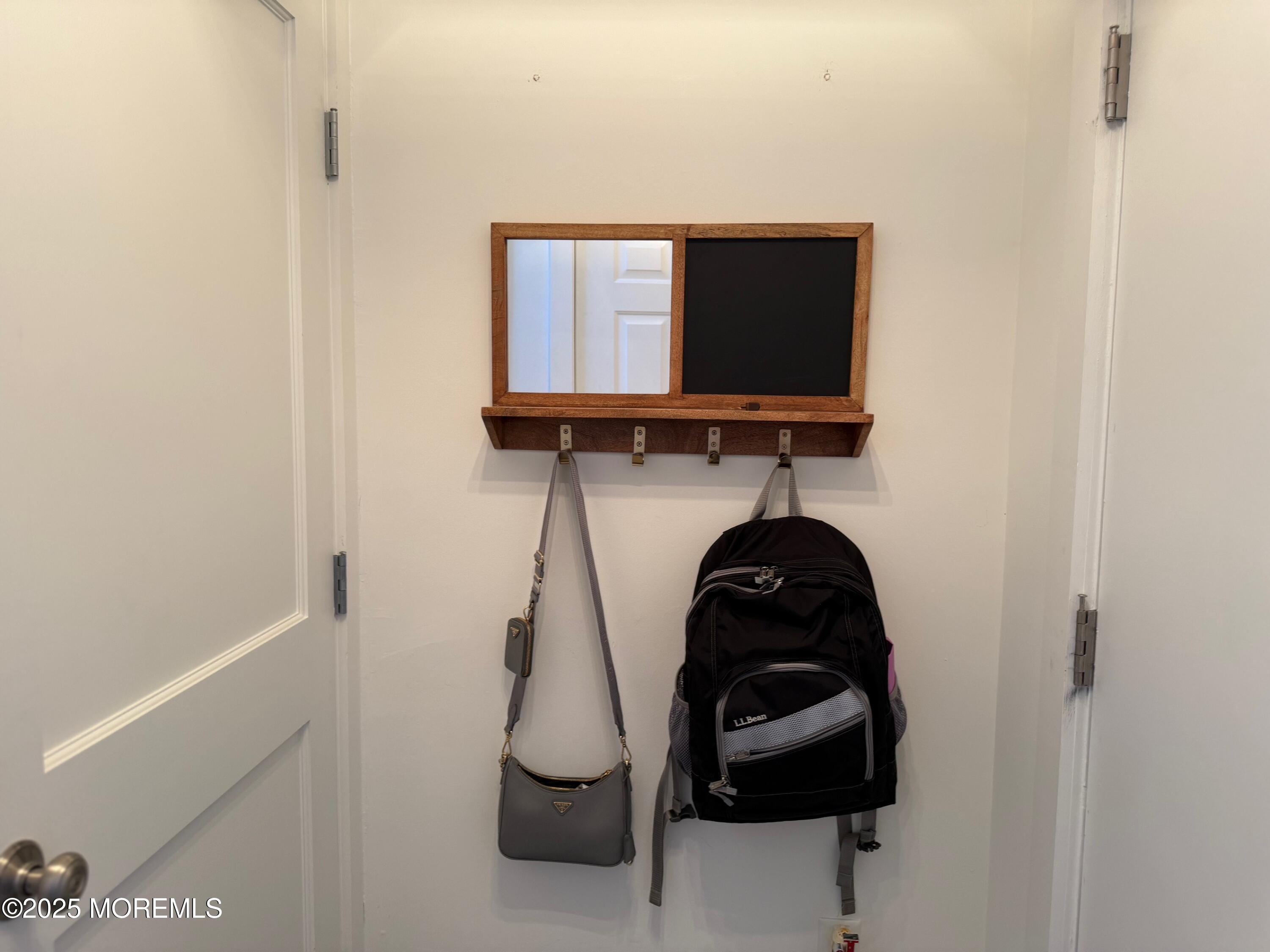 388 Deuce Drive Wall, NJ 07719 - Photo 4 of 38 a bathroom with a sink and a mirror