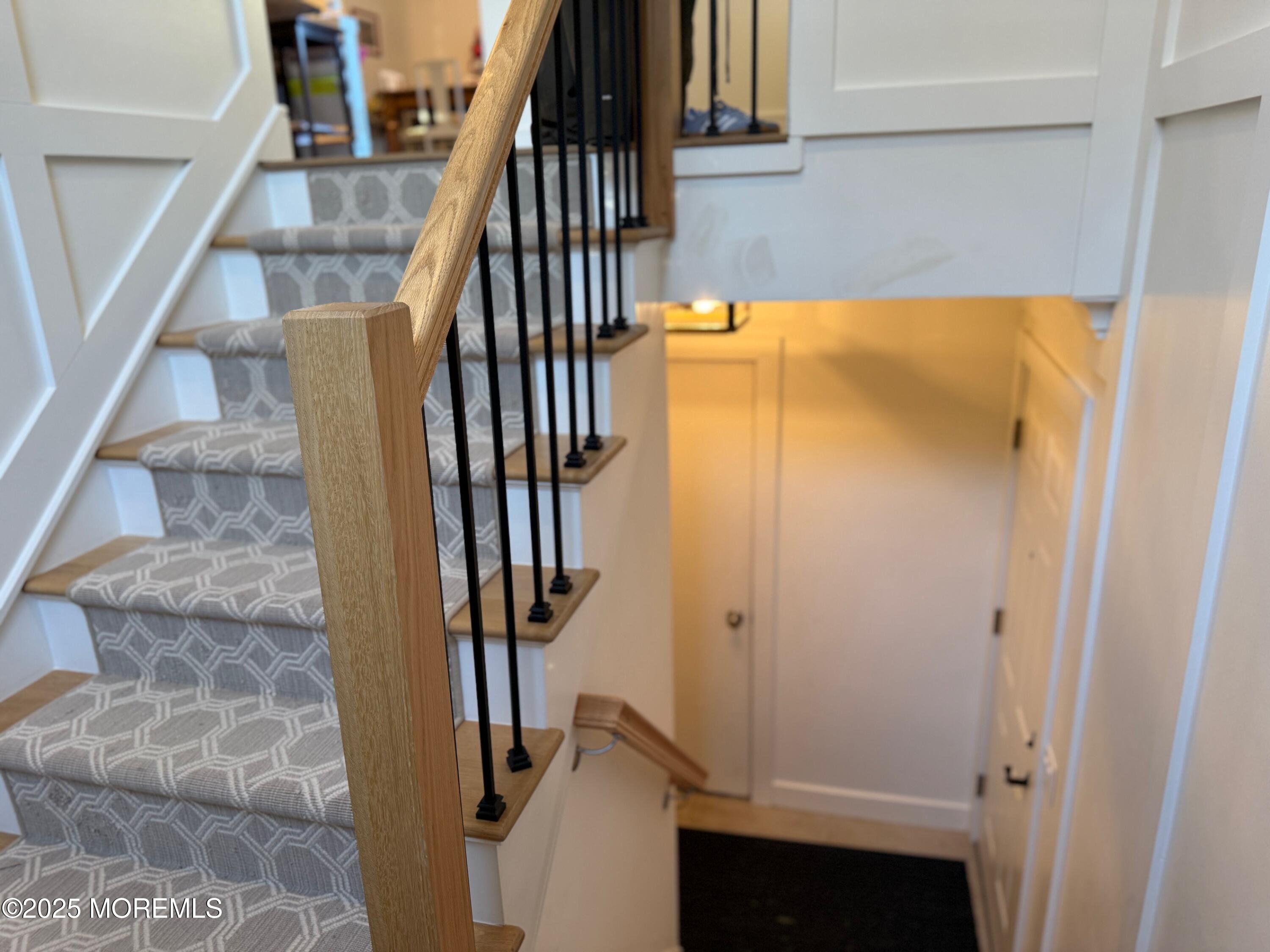 388 Deuce Drive Wall, NJ 07719 - Photo 6 of 38 a view of staircase with wooden floor and stairs