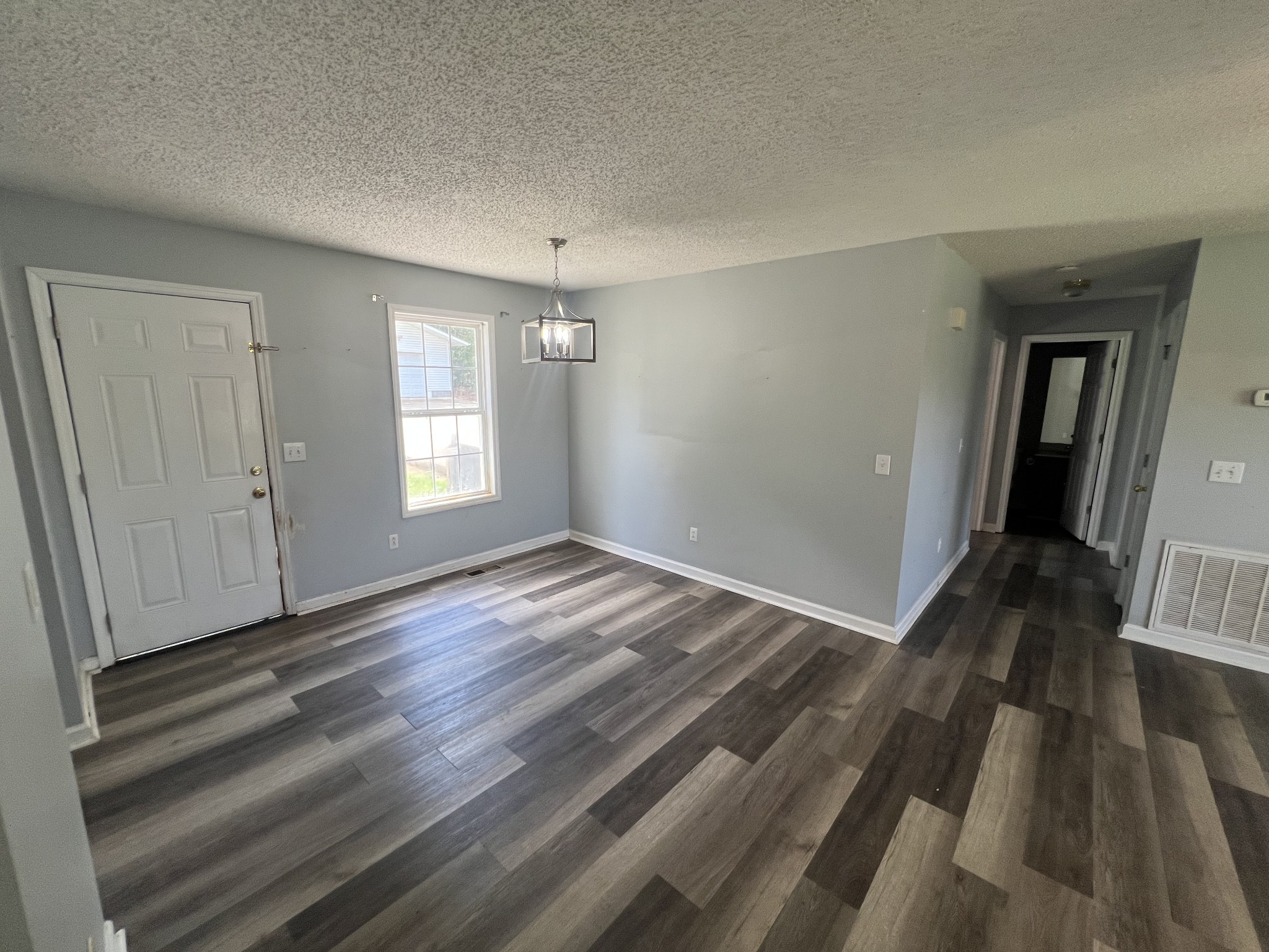 149 Hawthorne Street Pulaski, TN 38478 - Photo 6 of 33 a view of empty room with wooden floor and fan