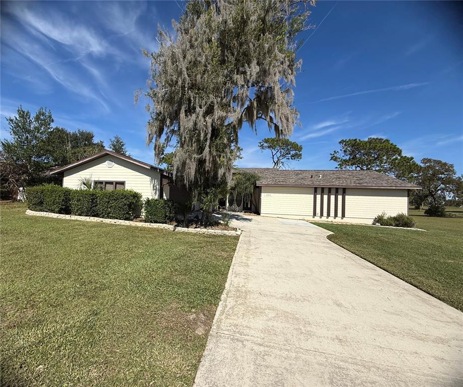 5544 Fairway Drive Ridge Manor, FL 33523 - Photo 1 of 1 a view of house with outdoor space and garden