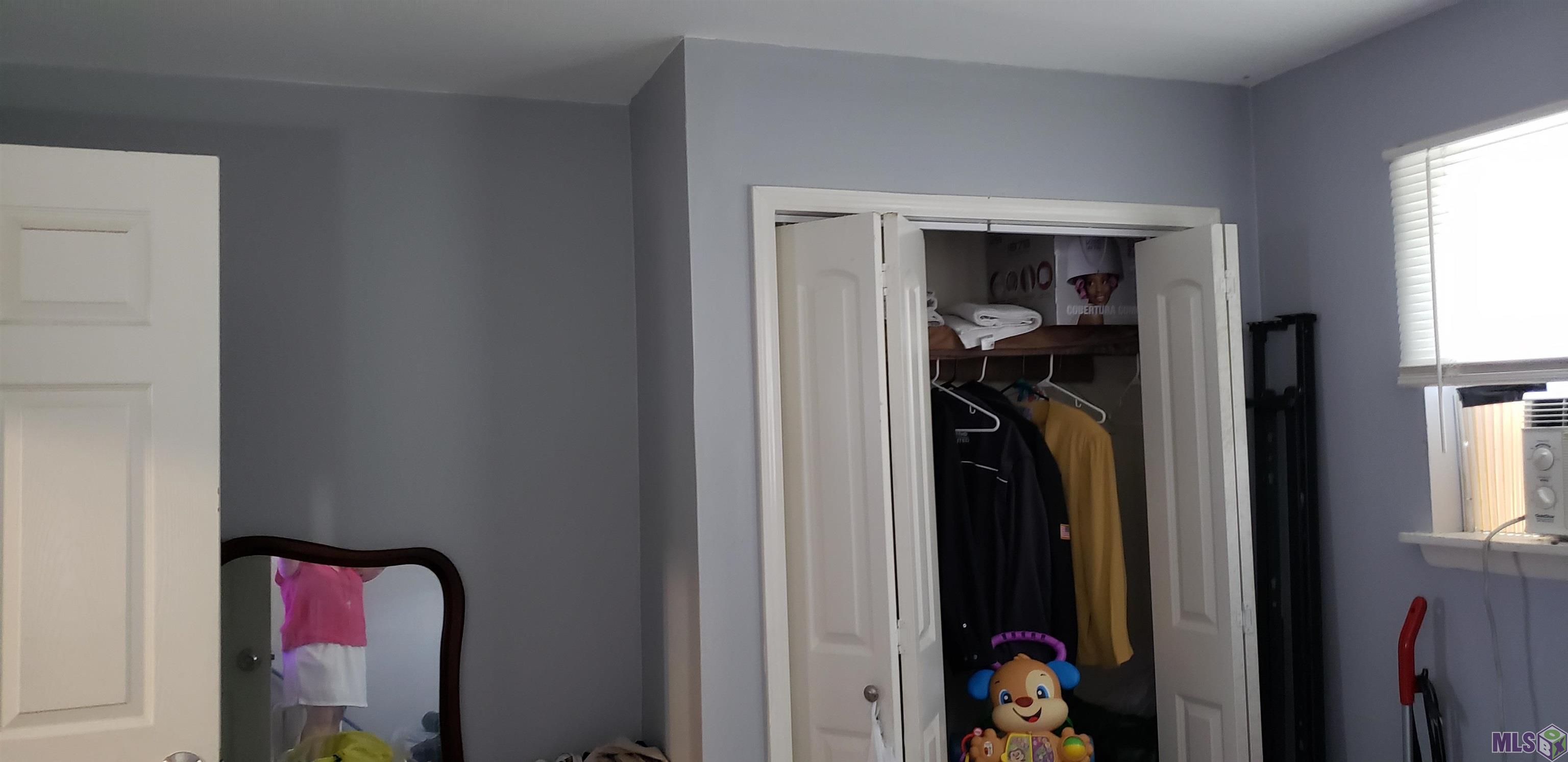 6032 Matthews Street Baton Rouge, LA 70812 - Photo 10 of 18 Master Bedroom Closet and Dressing Area