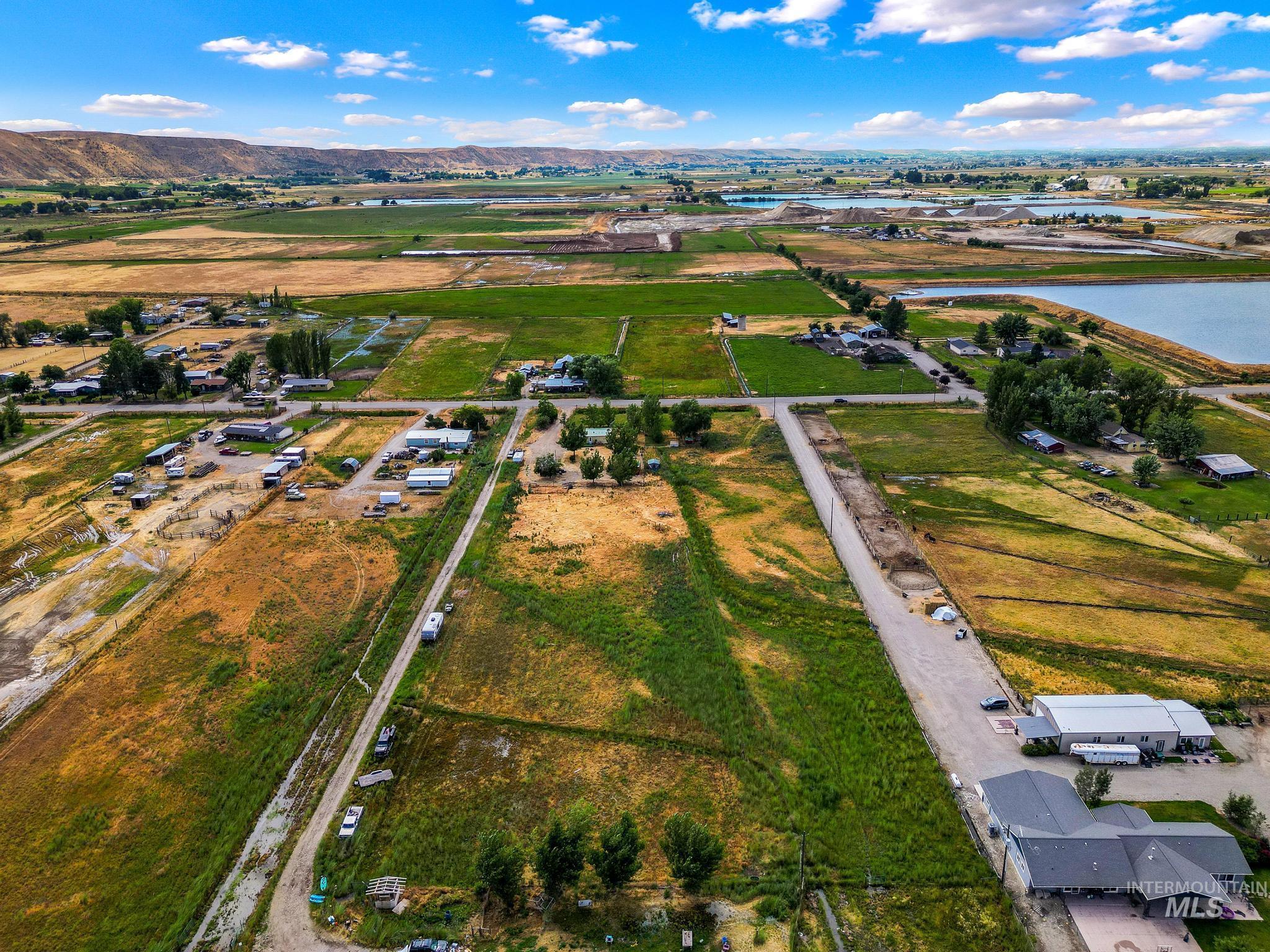 3680 South Mill Road Emmett, ID 83617 - Photo 36 of 38 Expansive property featuring a mix of green fields, undeveloped land, and scattered residential structures