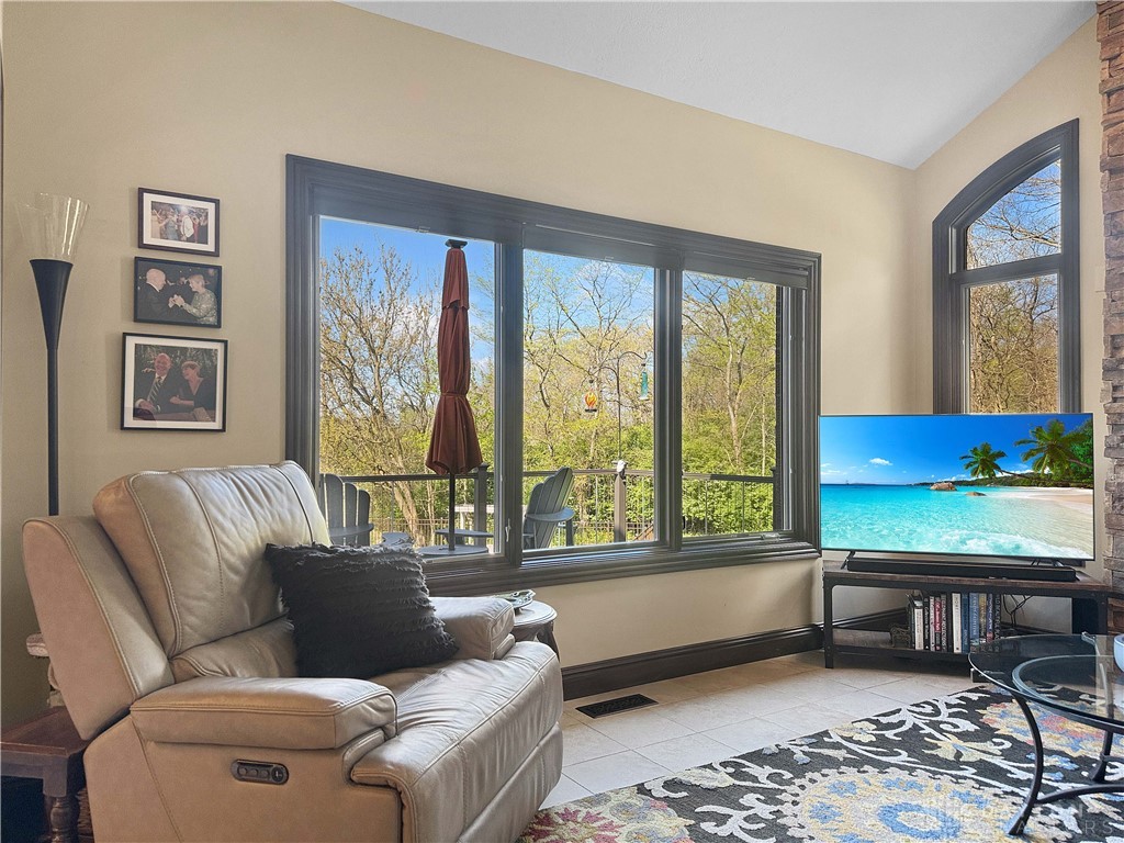 4096 Middle Urbana Road Urbana, OH 43078 - Photo 95 of 96 This family room offers expansive views of nature and comfortable indoor-outdoor living.