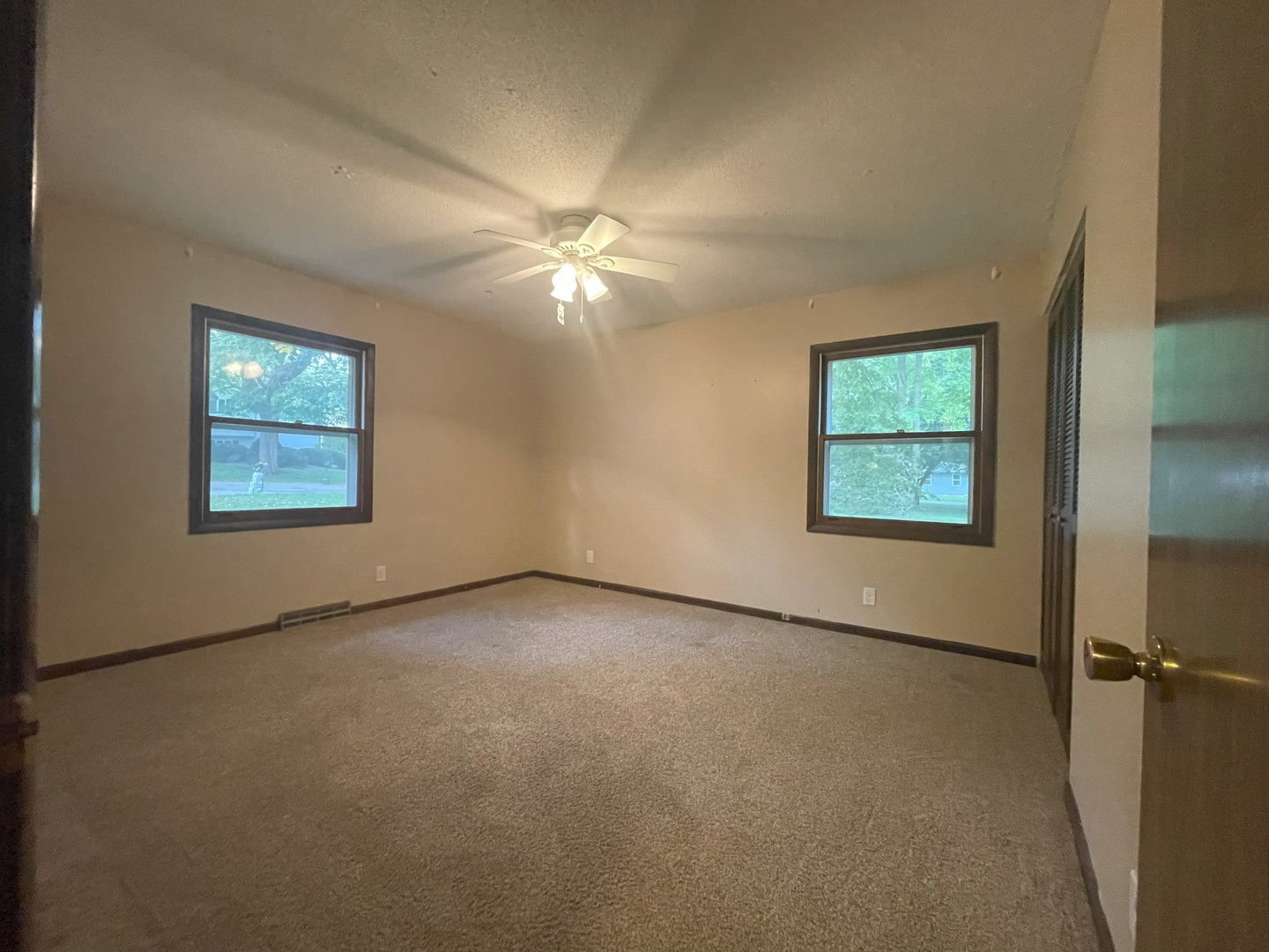 17 Circle Drive Saybrook, IL 61770 - Photo 11 of 17 an empty room with windows and fan