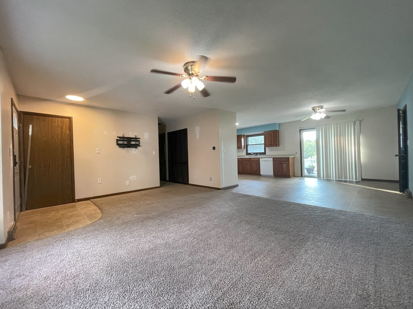 17 Circle Drive Saybrook, IL 61770 - Photo 13 of 17 a view of a livingroom with a chandelier fan and a kitchen